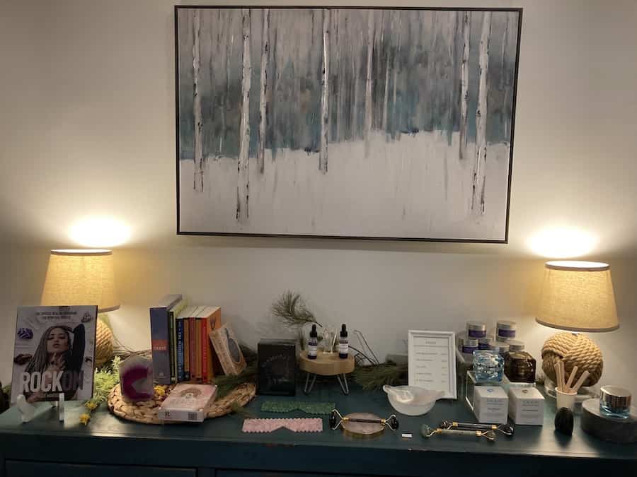 Photo of a display of products and painting from inside Shanti Life Inc.